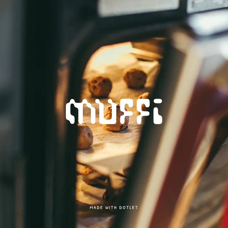 The Muffi wordmark in white over a photograph of cookies on a tray in an oven.